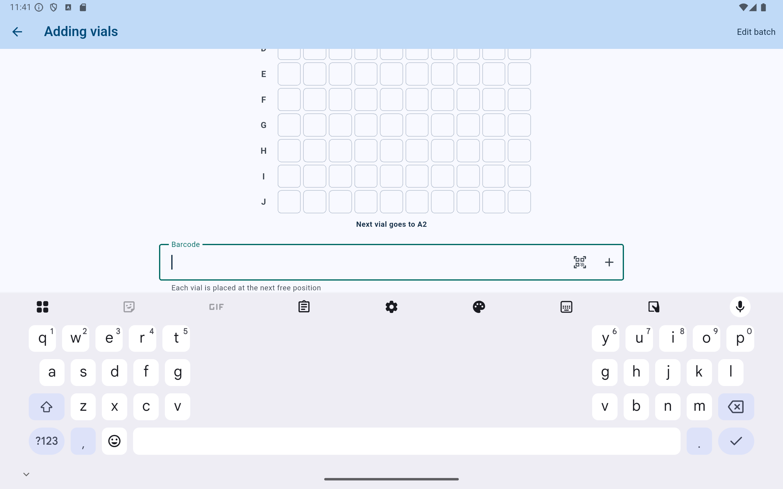 CryoIndex Adding vials screen with the next position A2, a focused barcode field, and the tablet keyboard.